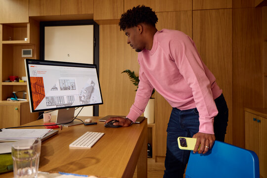Man checks his project on a computer