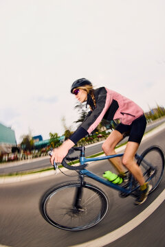 Woman Rides Bicycle Outdoors