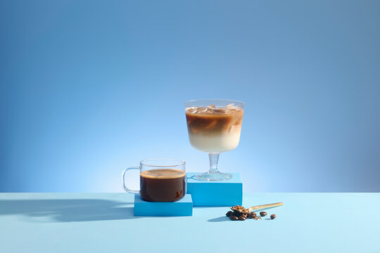 Two refreshing coffee drinks, one hot and one iced on blue background