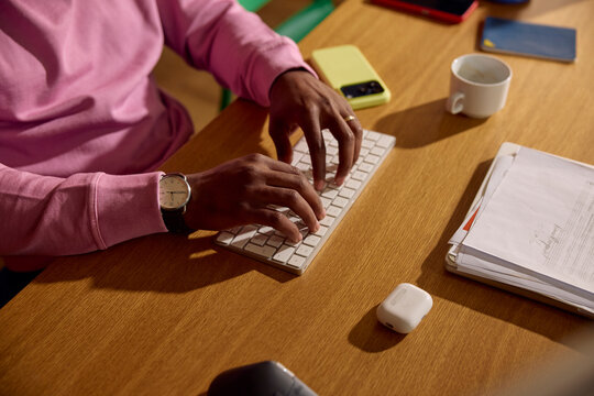 Anonymous person is typing on a wireless keyboard