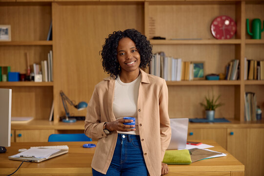 Beautiful woman stands in a home library