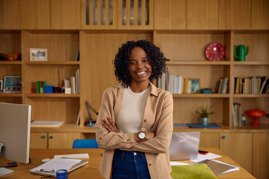 Casual woman smiles in a cozy office setting