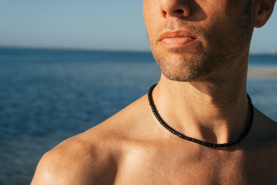 Man's Summer Skin and Necklace Beach Detail