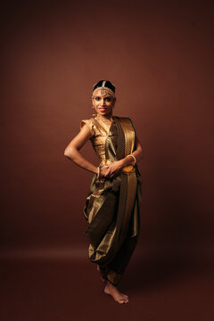 Indian bharatanatyam dancer performing traditional mudra pose
