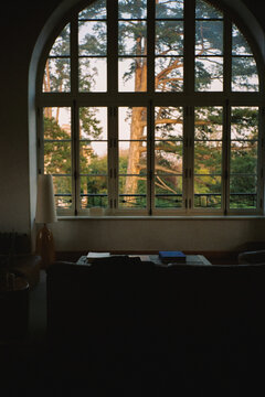 A large window inside a countryside hotel room near Paris