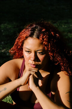 Female athlete focused on meditation and breathing exercises