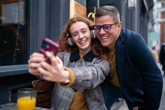 Taking selfie together at London pub