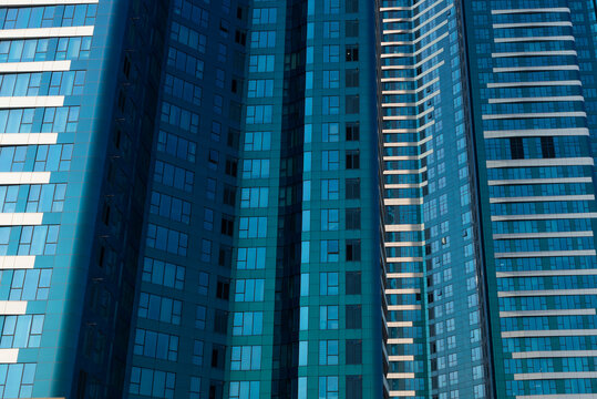 Modern Teal Glass Window Building Facade with Geometric lines