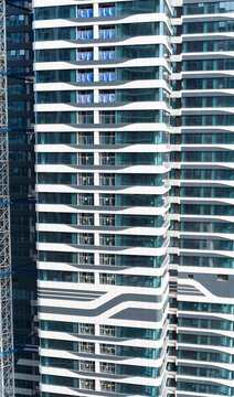 Modern Teal Glass Window Building Facade with Geometric lines