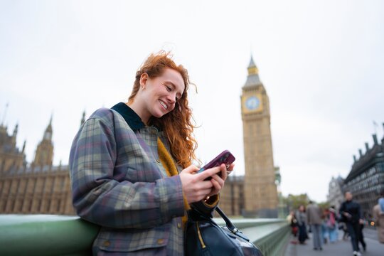 Checking phone near Big Ben
