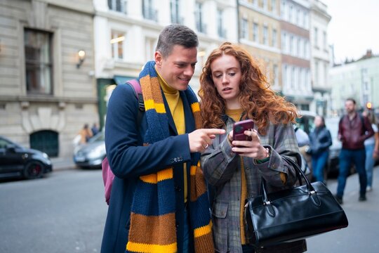 Tourists checking map together