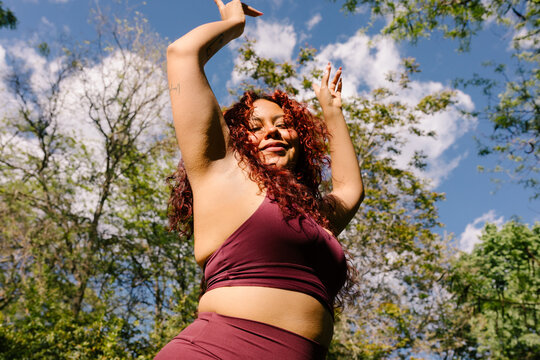 A woman committed to fitness enjoys exercise outdoors