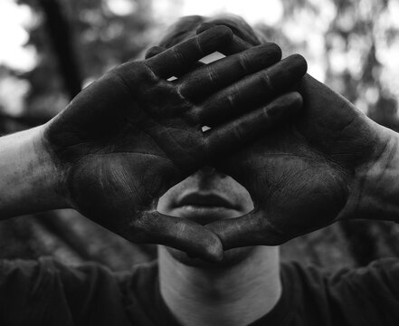 Person With Dirty Hands Covers Face Moody Portrait