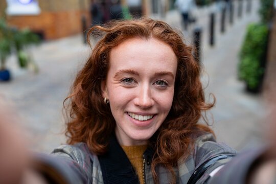 Smiling selfie portrait on London street