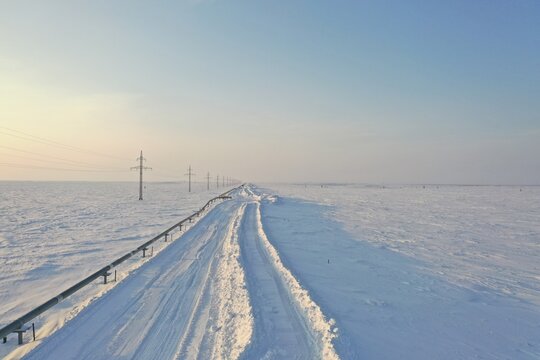 Snow Road In Frozen Tundra, Drone Shot