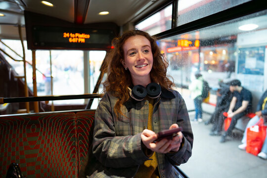 Using smartphone inside London bus