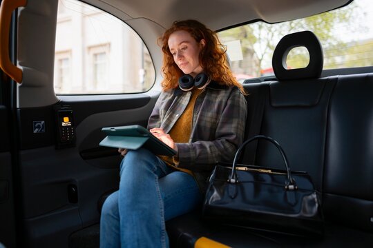 Reading book during taxi ride in London