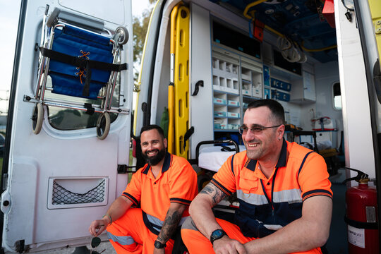 Paramedics smiling in ambulance