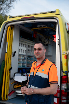 Paramedic standing in front of ambulance ready for duty