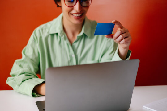 Woman with credit card making payments