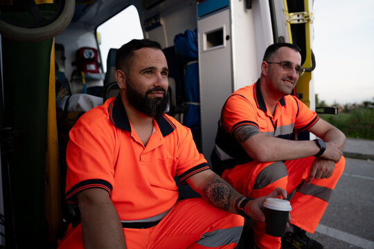 Paramedics taking a coffee break near an ambulance