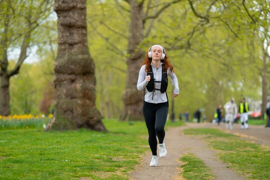 Woman jogging on path in park