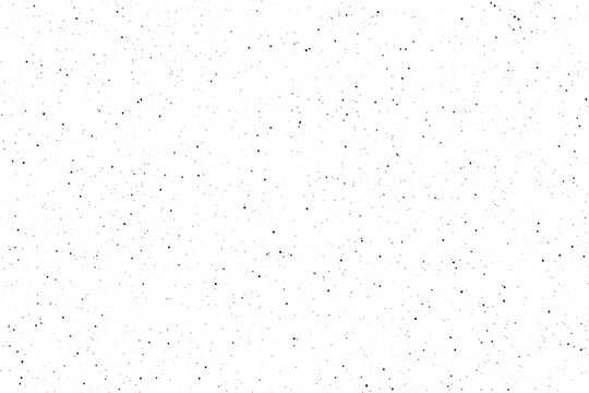 A uniform dispersion of minute black flecks against a bright white plane creating a quiet textured visual