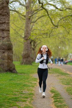 Woman running on park path