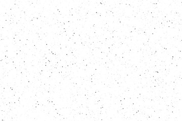 Naklejka premium A simple white surface covered with numerous small scattered black dots creating a speckled texture