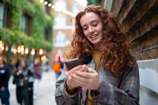 Reading message while walking in London street