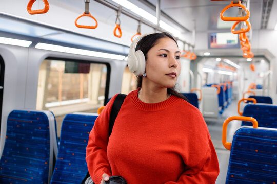 Woman walking in train aisle