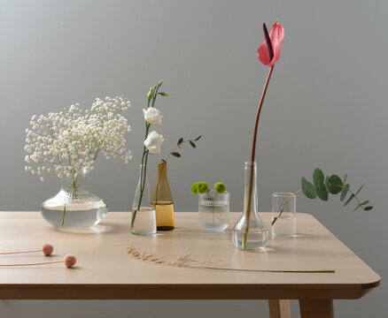 Refined Floral Composition with Mixed Glass Vessels