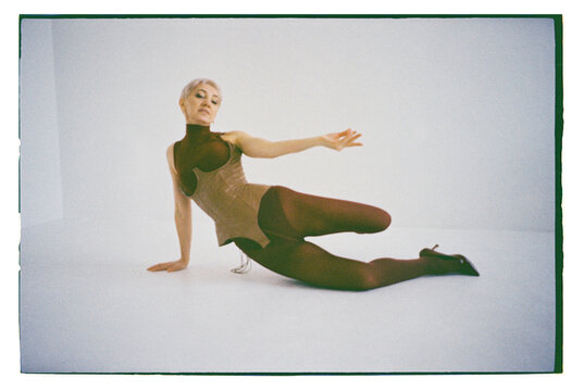 A dancer poses in a studio