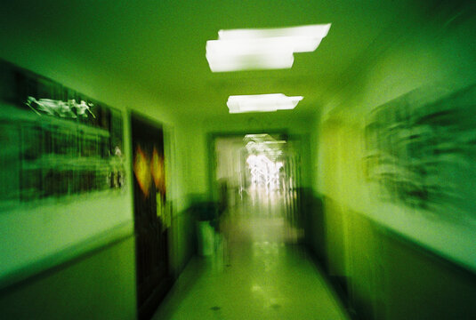 Motion Blur Corridor with Green Light and Exit Glow