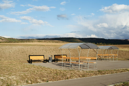 Scenic Rest Area With Benches Against a Tranquil Landscape