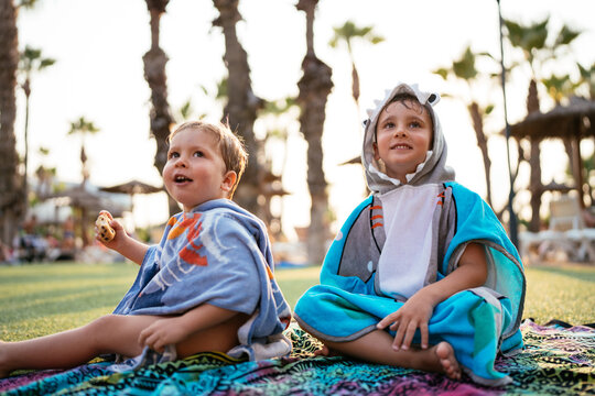 Happy brothers enjoying summer vacation outdoors