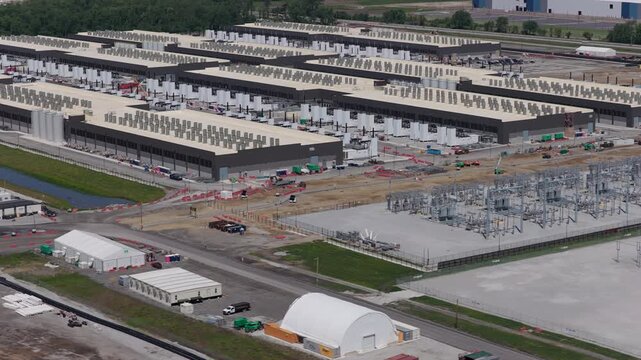 Aerial View of Hyperscale AI Data Center buildings with Cooling Units and Server Buildings, new construction