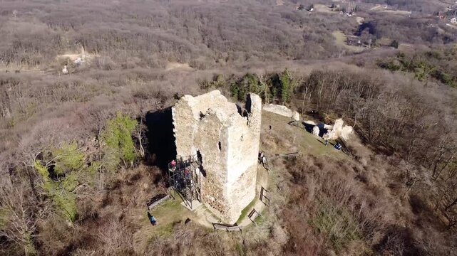 Aerial view of Vrdnicka Kula medieval tower ruins in Fruska Gora, Serbia, surrounded by forested hills. g.