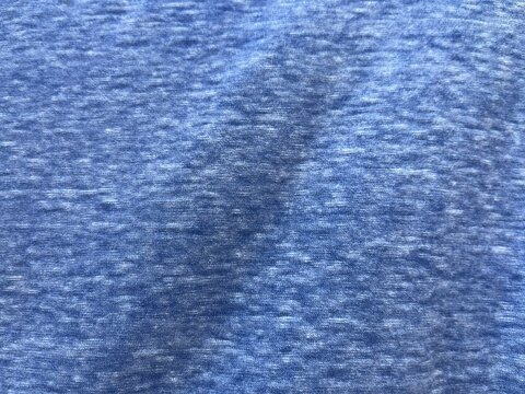 Blue heathered jersey fabric texture background with soft natural fold and cotton knit pattern