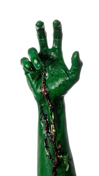 A green, severed arm with exposed veins and blood, palm facing outward