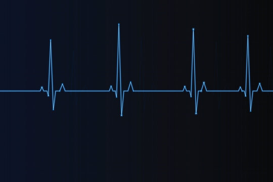 Blue electronic ecg heartbeat wave pattern on dark background, electrocardiogram blue lines