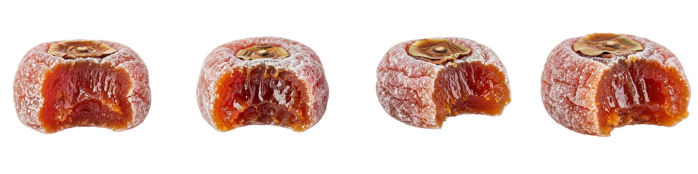 Dried persimmon fruits with bite marks isolated on black background
