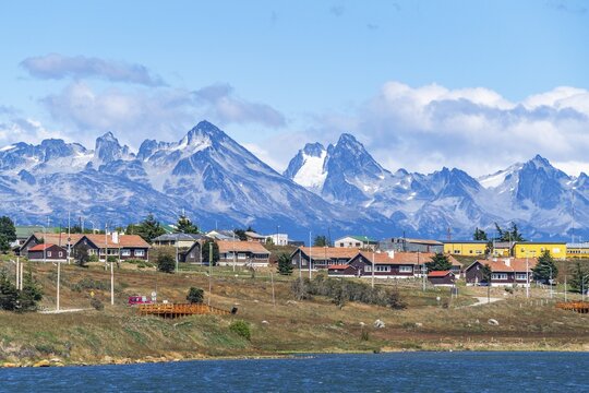 Architecture in the city of Ushuaia, behind the mountains of the island Hoste Chile, island Tierra del Fuego, Patagonia, Argentina