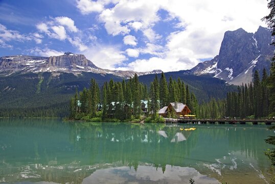 Lake with crystal clear water, small lodge on an island surrounded by high mountains, Emerald Lake, Yoho National Park. Rocky Mountains, British Columbia, Canada