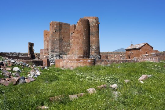 Robust ancient brick structure in an open, green landscape, Dashtadem Fortress, Qagheni Fortress, Dashtadem village, Aragatsotn Province, Armenia