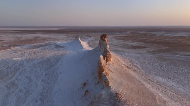 Aerial view of Bozzhyra View Point 1 featuring white chalk cliffs and vast desert plateaus under a soft morning light in Karakiya District, Mangystau Region, Kazakhstan.