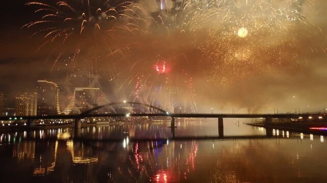 Night fireworks over Belgrade Waterfront and Sava River, Belgrade, Serbia, reflected in water. g.