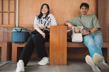 asian couple smile and happy during play with they cat in coffee shop © tickcharoen04