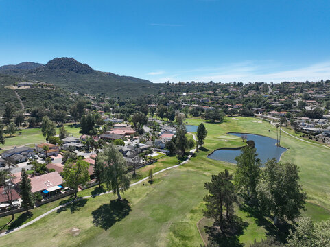Aerial view of Ramona neighborhood with mountain, valley and San Vicente Golf Course, in California, USA