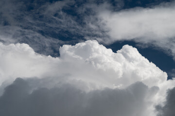 Obraz premium Textured cloud shapes suitable for futuristic themes. Abstract cloud formations featuring textured surfaces designed for contemporary data and tech presentations